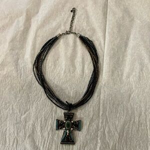 Multi strand beaded necklace with large cross pendant: turquoise brown and more